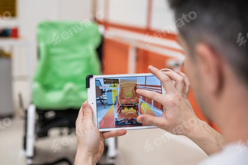 Preview: Man scanning wheelchair cushion with tablet