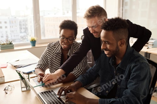 Preview: Team Using Laptop when Coworking in Office