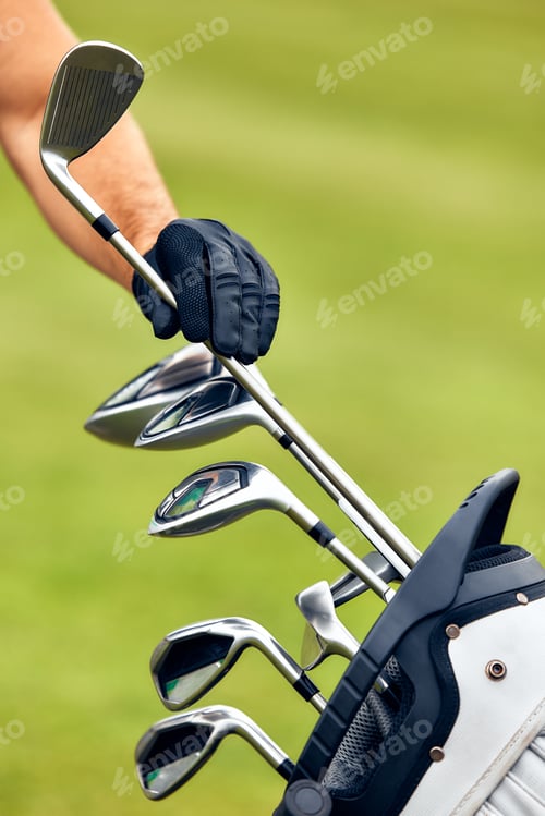 Preview: A Golfer Fully Prepared to Take a Powerful Swing on the Golf Courses Green Grass