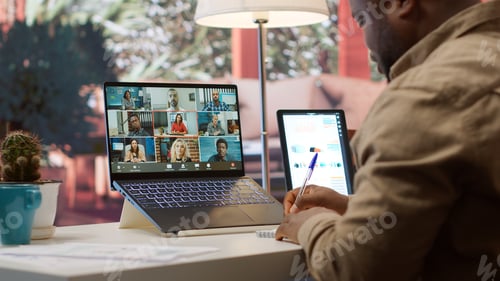 Preview: Businessman presents annual sales reports to the shareholders on videocall