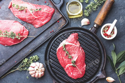 Preview: Fresh raw meat. Beef Tenderloin and marbled beef steaks on grill pan