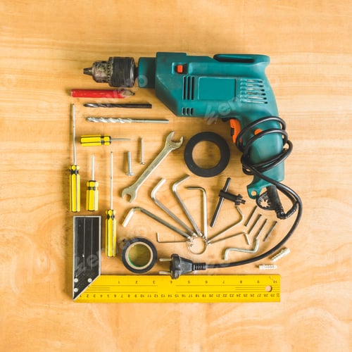 Preview: Set of different work tools on wooden table background.