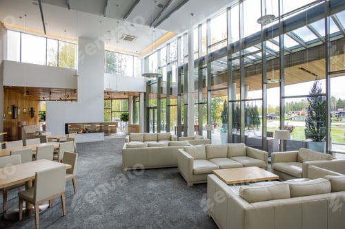Preview: Interior of comfortable restaurant with tables and soft white leather couches