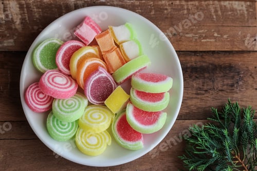 Preview: Top view of a plate with colorful sweet jelly marmalade sweets and candies