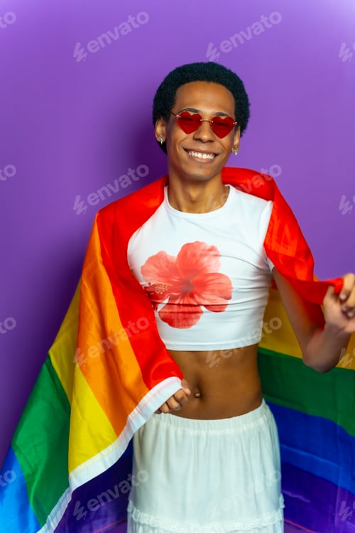 Preview: Latin gay man wrapped in lgtb flag