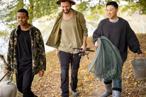 Preview: Men walk with dog and fishing equipment in nature
