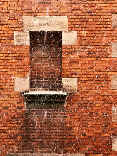Preview: White Snow Falling in Front of Red Brick Wall