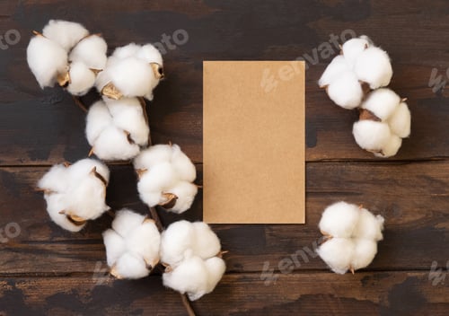 Preview: Blank card with cotton flowers top view on dark brown wood, wedding mockup