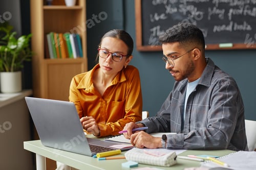 Preview: Caucasian Woman and Young Middle Eastern Man Studying at Language School