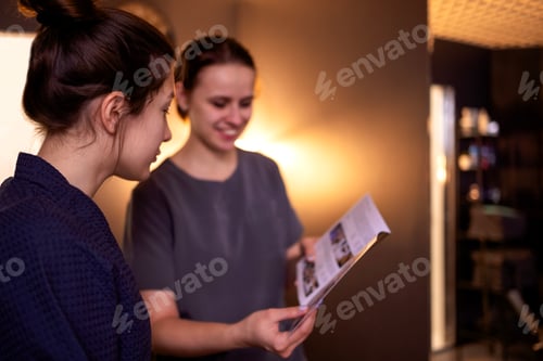 Preview: Pretty caucasian beautician communicates with her female client