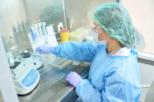 Preview: Virologist laboratory assistant works with virus samples in sterile room