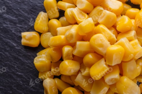 Preview: canned corn on a dark stone background