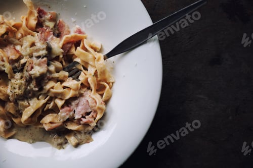 Preview: Pasta White Sauce With Bacon And Mushroom On Wood Background In Mystic Light