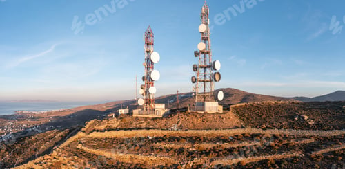 Preview: Cell tower. Cellular base station, mobile phone antenna aerial view. Rural island background