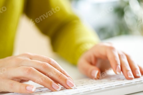 Preview: Woman office worker typing on the keyboard