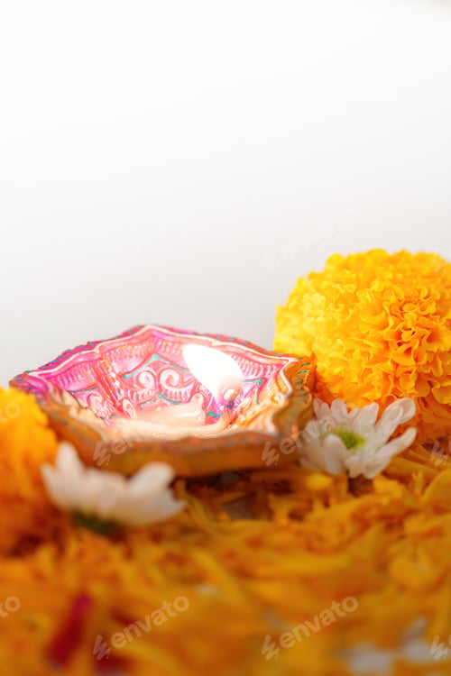 Preview: Diwali Festival. Colorful oil lamps and marigold flowers for celebration.