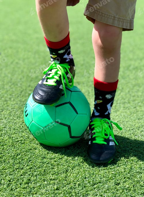 Preview: Boys foot on small soccer ball