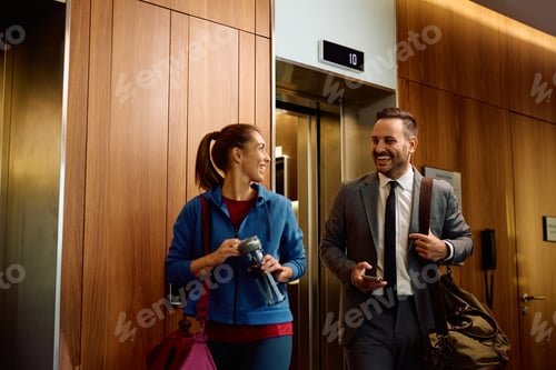 Preview: Happy couple talking while going to the gym for a sports training.