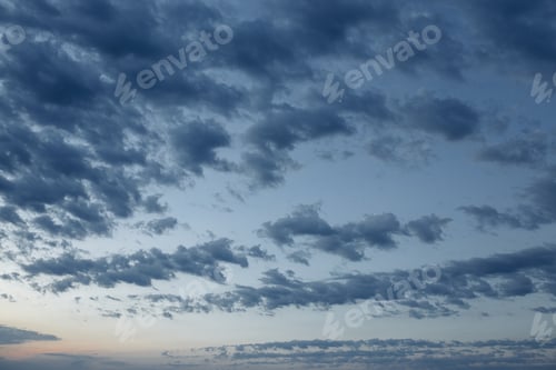 Preview: Beautiful evening clouds in blue sky for background.