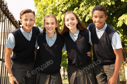 Preview: Teenage students in stylish school uniform outdoors