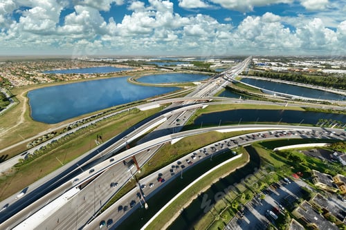 Preview: Aerial view of american highway junction with fast driving vehicles in Miami, Florida.