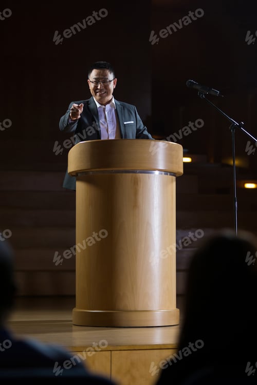 Preview: Business executive pointing while giving a speech