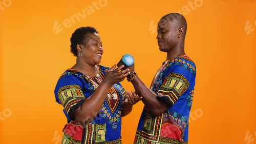 Preview: Ethnic woman supporting her husband to workout