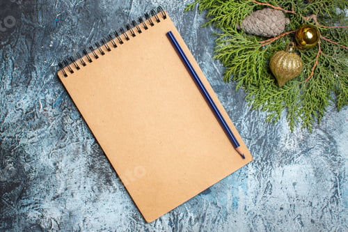 Preview: top view simple notepad with pencil on light background color photo pen copybook xmas