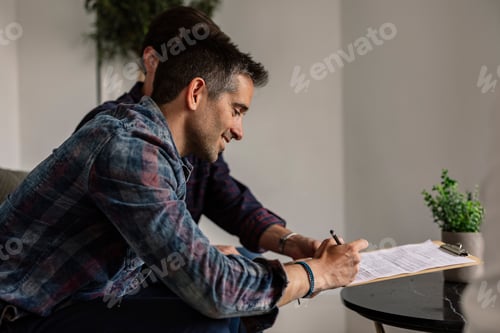 Preview: gay marriage new owners signing the purchase contract for their new house