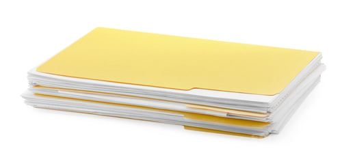 Preview: Stack of file folders with papers isolated on white