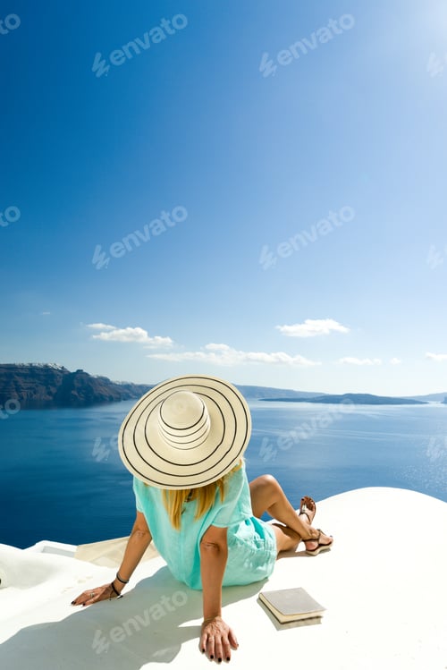Preview: Woman on holidays in Santorini Greece