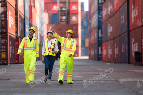 Preview: Group of engineers working with laptop in the container yard.