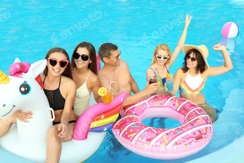 Preview: Group of happy people enjoying fun pool party