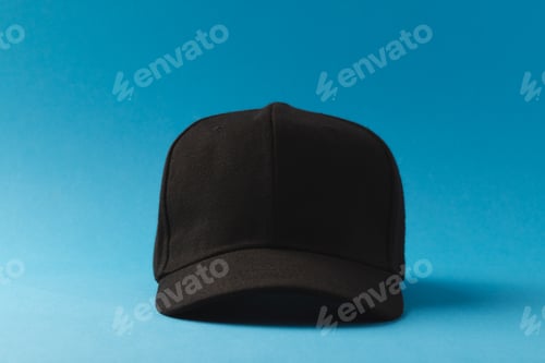 Preview: Black baseball cap and copy space on blue background