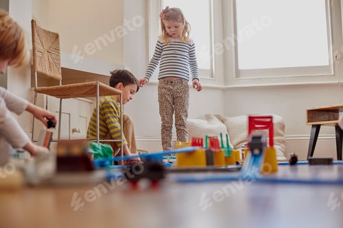 Preview: Children Play with Toy Train Set in Home