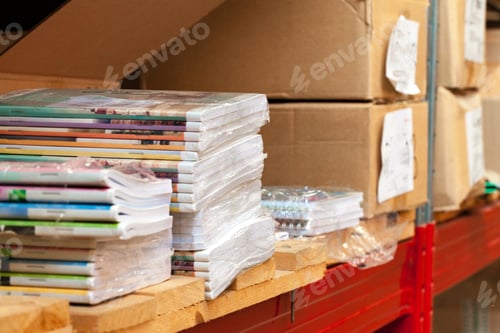 Preview: Cardboard sheets pack on a shelf of warehouse