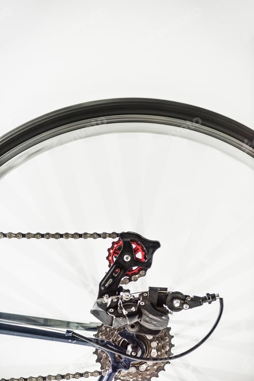 Preview: bicycle gears and wheel in motion isolated on white