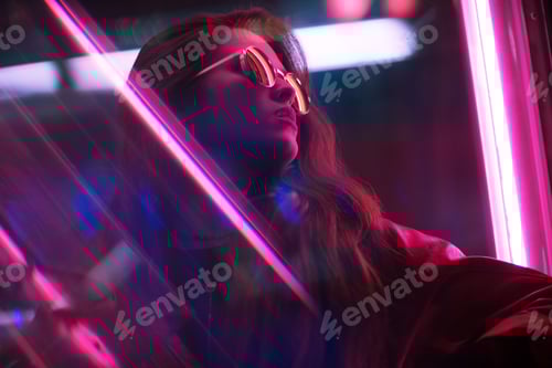 Preview: Portrait of young woman with long black hair and red leather jacket with neon pink lights