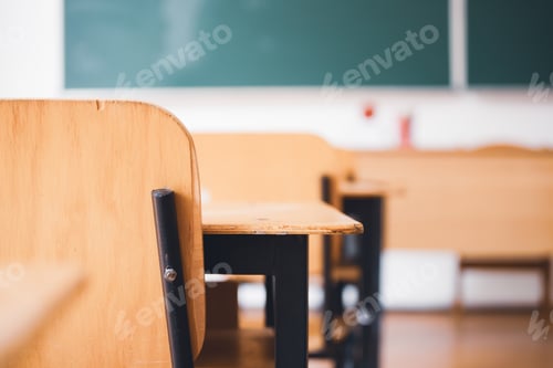 Preview: Empty Classroom with Wooden Desks and Green Chalkboard