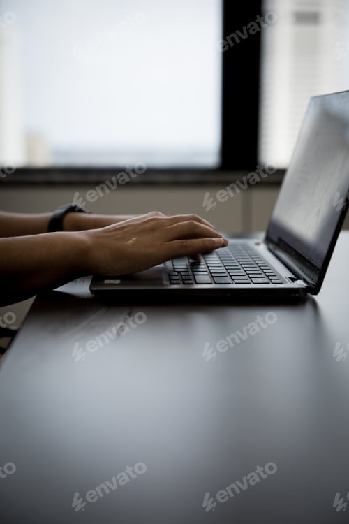 Preview: Laptop on work desk in corproate office woman typing hand