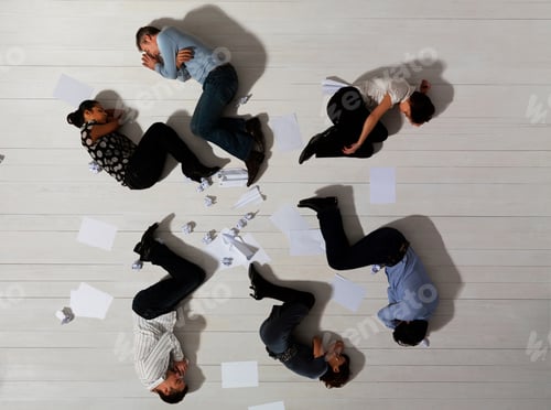 Preview: Business men and women asleep on floor