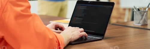 Preview: Caucasian Man Studying Programming on Laptop in Prison Classroom