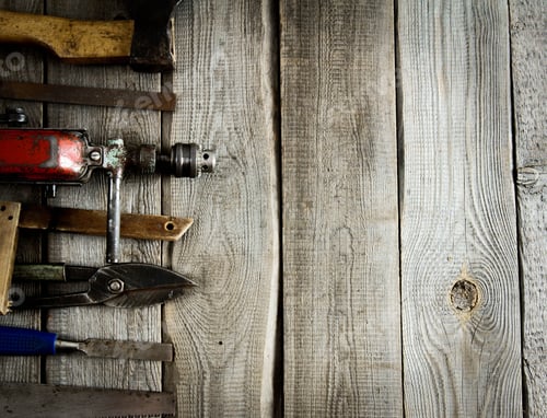 Preview: Various tools on a wooden background.