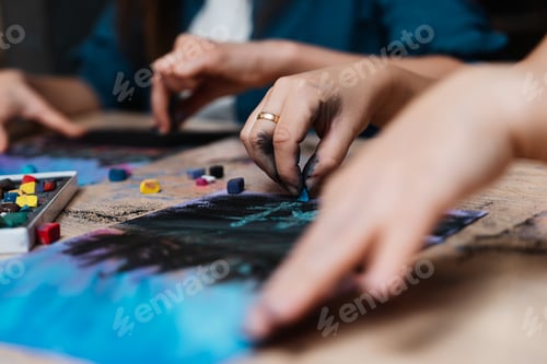Preview: Engaged artists creating vibrant pastel drawings at a creative workshop
