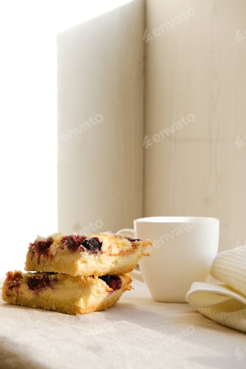 Preview: Homemade pie with cheese and berries. Cheesecake. Cup of tea. Cozy breakfast. Sunlight.