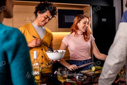 Preview: Friends Enjoying a Relaxed Meal at Home Together