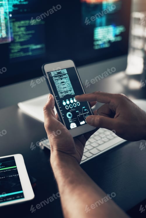 Preview: Cropped shot of an unrecognizable man using a cellphone in a modern office