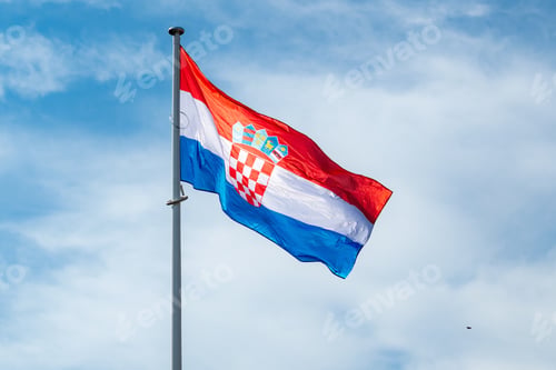 Preview: The national flag of Serbia waving in the blue sky