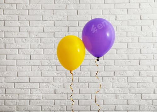 Preview: Bright balloons near brick wall, space for text. Celebration time
