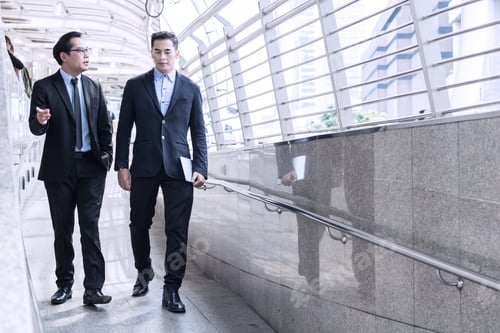 Preview: team of business people stand talking and discussing on the way